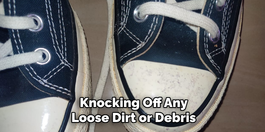 Knocking Off Any Loose Dirt or Debris
