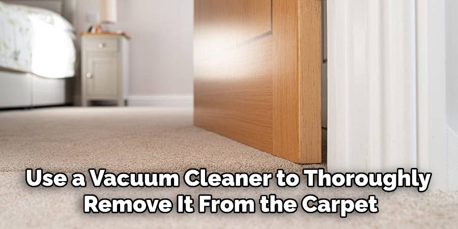 Use a Vacuum Cleaner to Thoroughly
Remove It From the Carpet